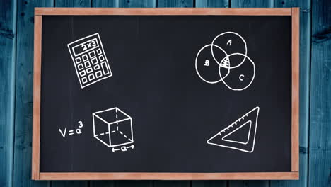 iconos matemáticos contra el tablero negro