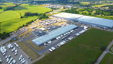 Aerial-view-of-warehouse-storages-or-industrial-factory-or-logistics-center-from-above