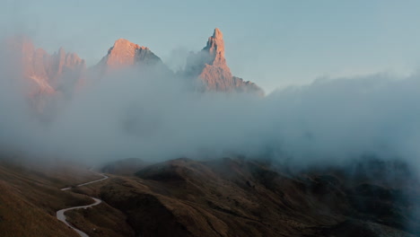 misty mountain peaks at sunrise/sunset