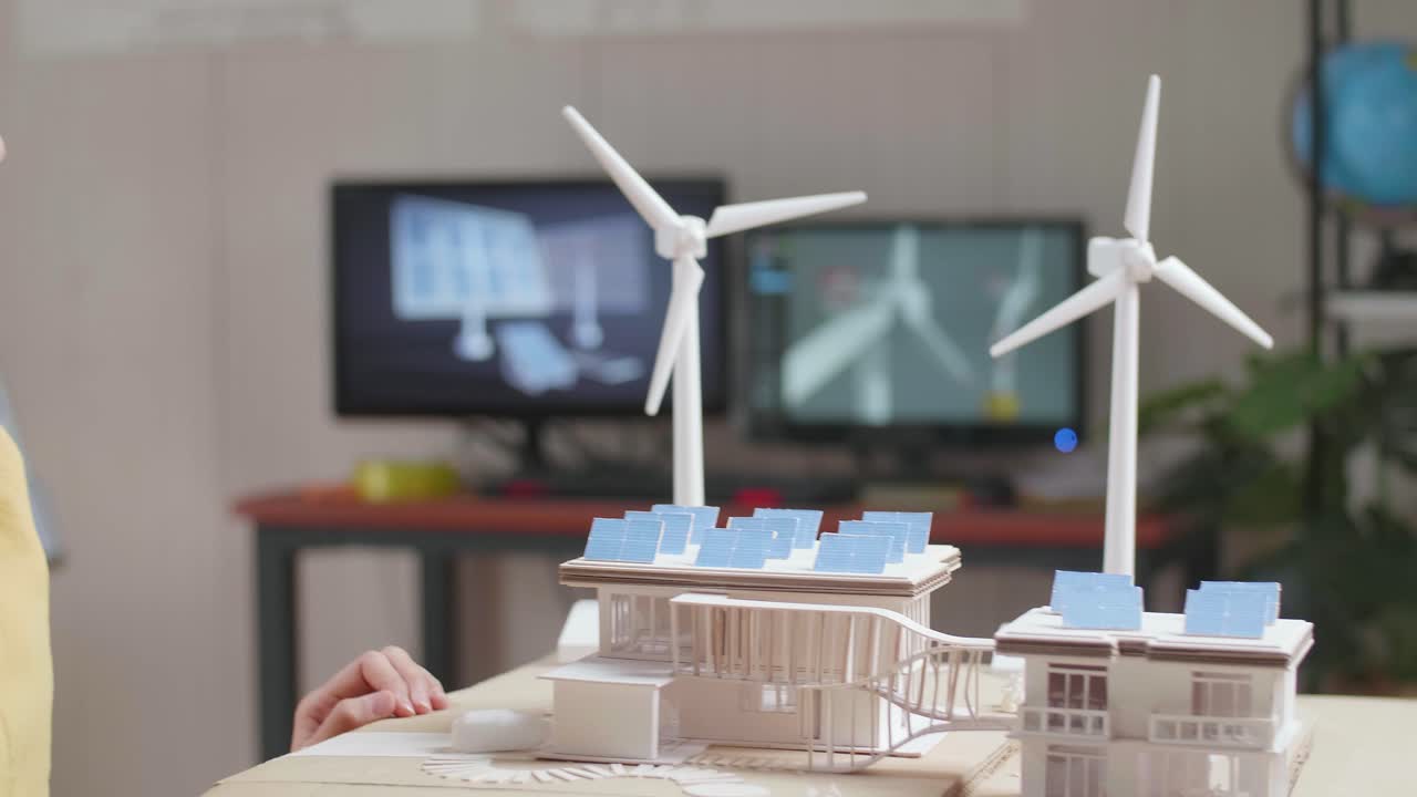 지속 가능한 건축 디자인 프로젝트를 축하하는 흥분한 학생