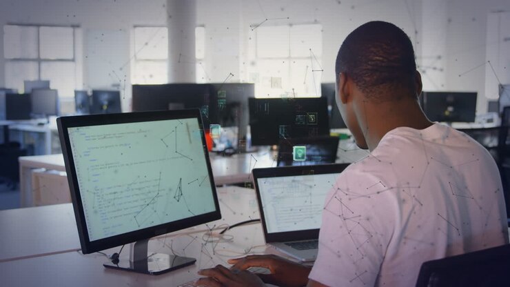 Animation of shapes and media icons over african american businessman using compuer in office