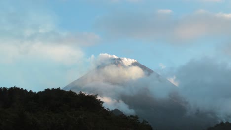 Mount-Merapi-active-volcano-in-Java,-Indonesia,-surrounded-by-clouds