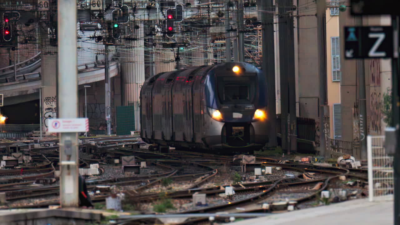 Nice, France - February 4, 2025: Trains moving on the rails in the Nice Ville Central train station