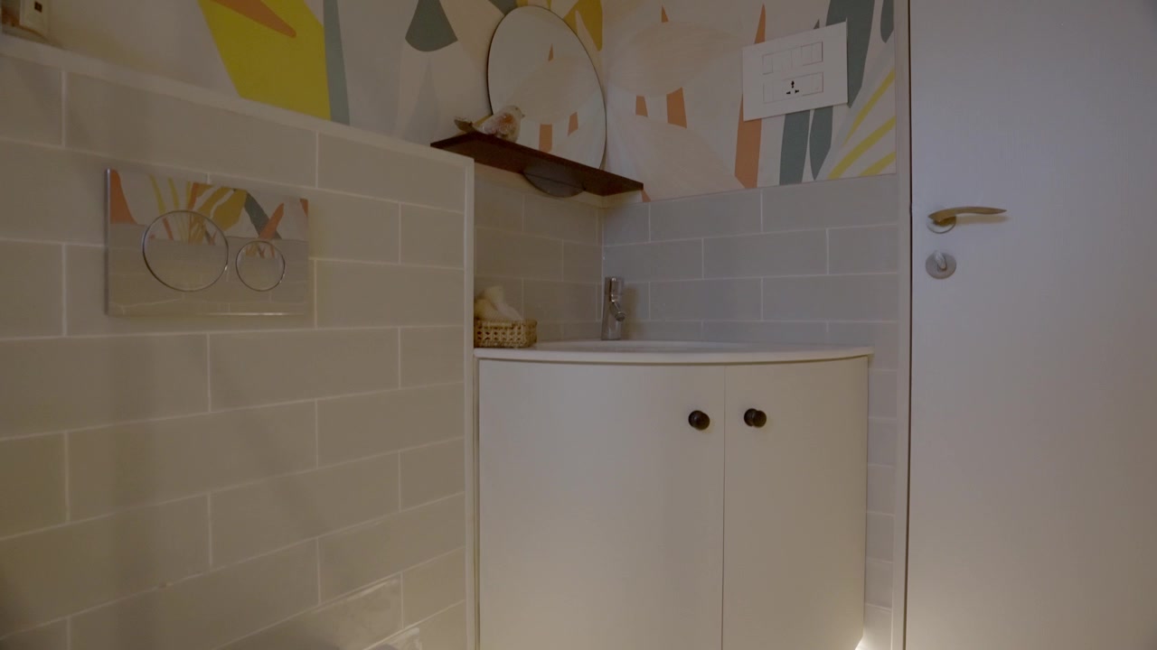 LED Under Cabinet Lighting Of A Modern Bathroom. Pan Up Shot