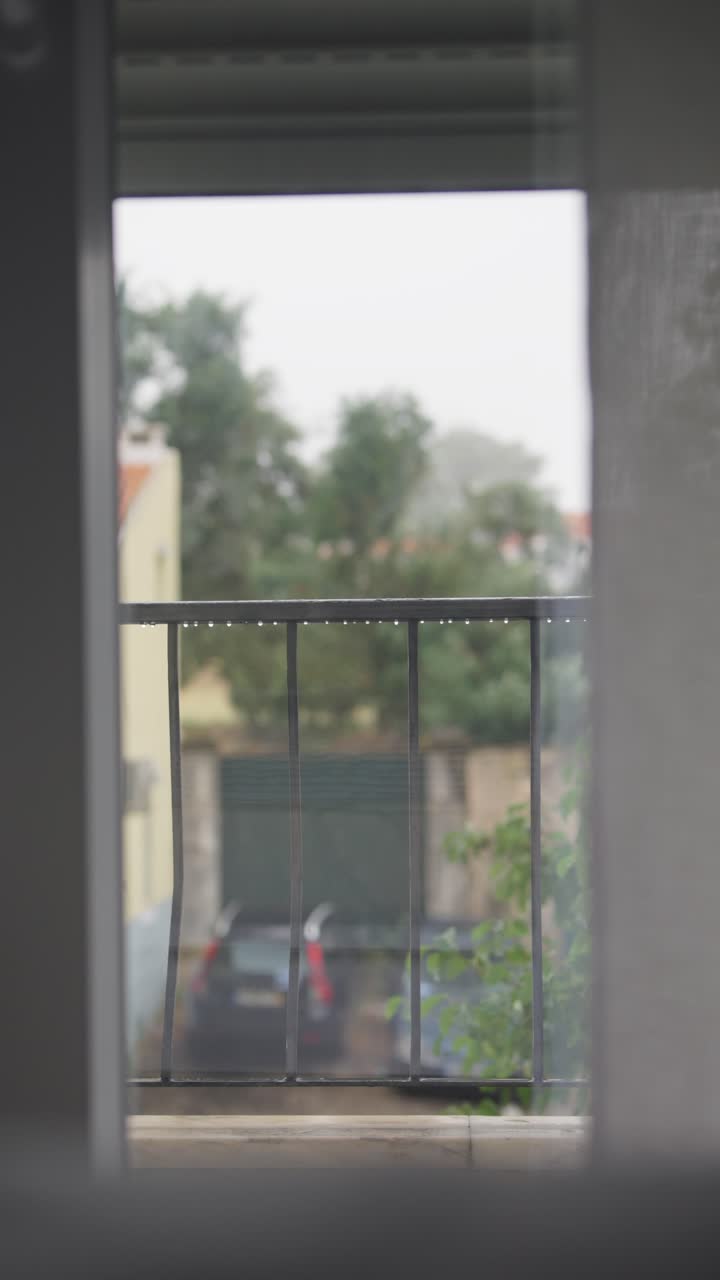 Rainy View from a Balcony Window