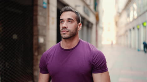 young man walking through commercial street outdoors.