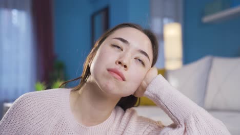 Portrait-of-thoughtful-Asian-young-woman.