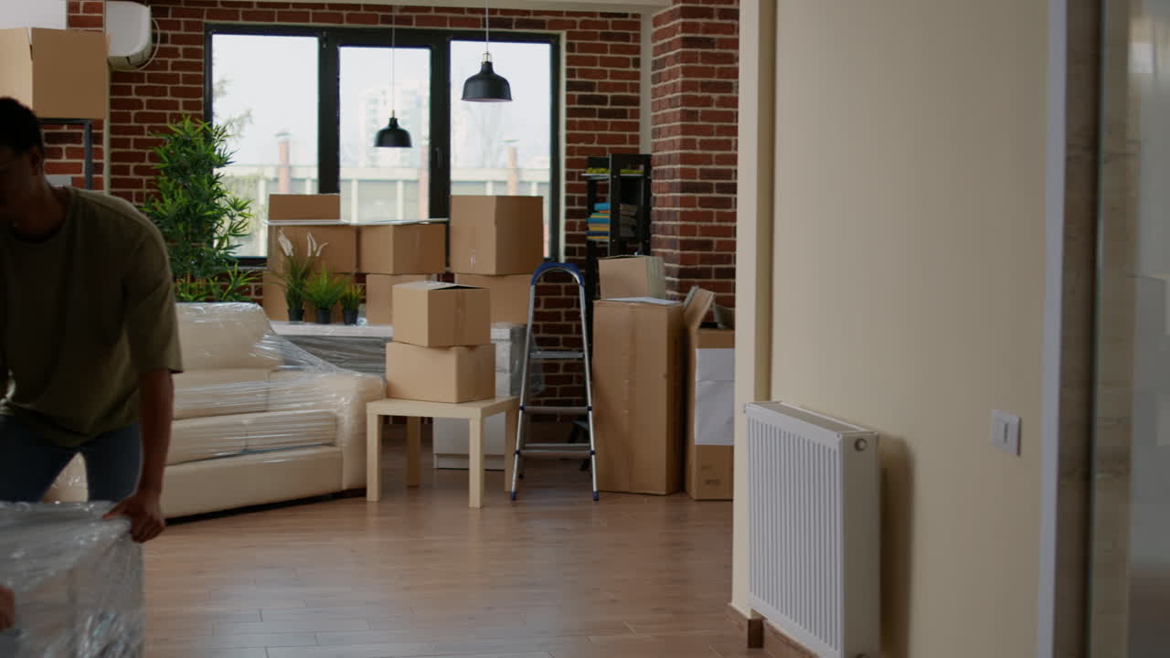Married couple decorating new household with furniture