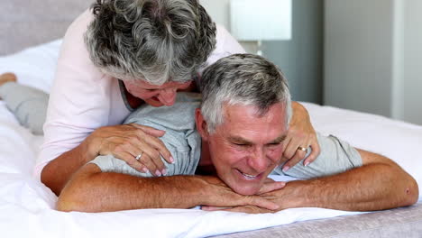 Woman-giving-husband-shoulder-rub