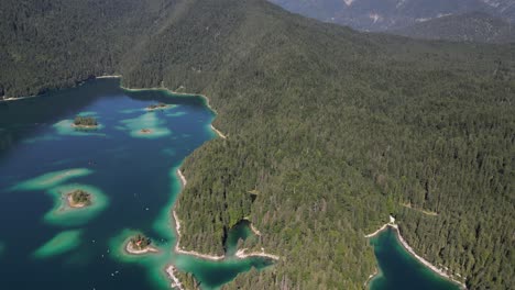 wonderful deutschland scenic natural landscape of bavaria eibsee bayern in a summer hazy day green nature of pine tree forest in highlands water sport yacht club in turquoise blue green crystal water