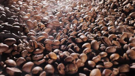 close up of seeds of coffee. fragrant coffee beans are roasted smoke comes from coffee beans.