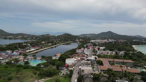 Aerial-shot-of-beach-and-coastal-city-