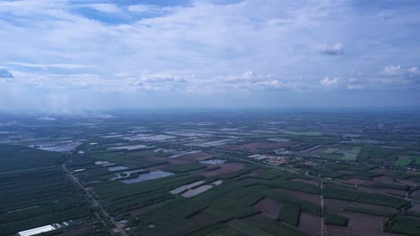 high altitude view of mekong delta farmland with rice fields and fish farming