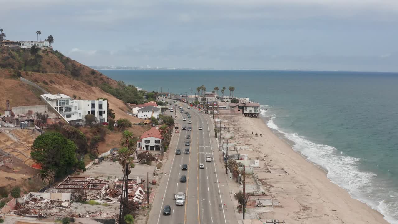 Low aerial shot flying over Pacific Coast Highway near Las Flores Canyon after the wildfire in Malibu, California. 4K