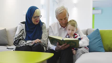 muslim family generations grandparents reading quran with grandchildren at home