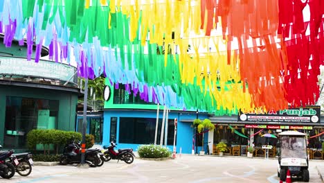 vibrant ribbons decorate a bustling market street