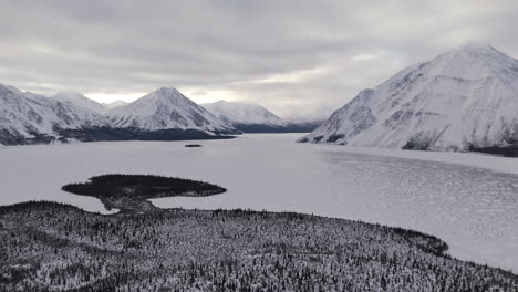 winterly atmosphere over kathleen lake within kluane national park and reserve in yukon, canada. aerial wide shot