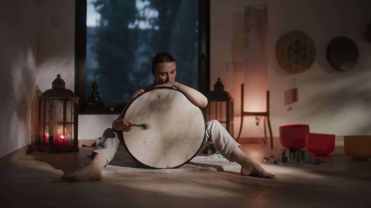 Woman Meditating with a Drum
