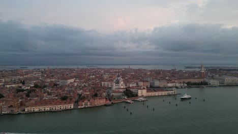 expansive aerial view of venice skyline and waterfront with moody clouds overhead.