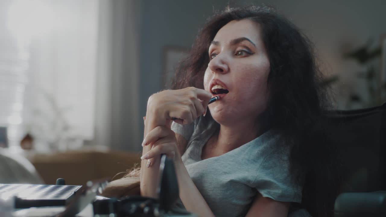 Woman in Wheelchair Applying Makeup