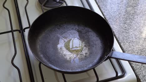 cooking oil poured into frying pan