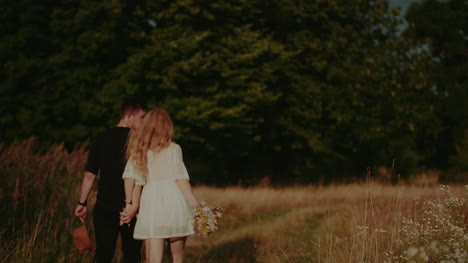 attractive carefree young couple walking and smiling on holiday