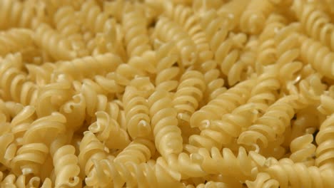 fusilli pasta laid out 4k