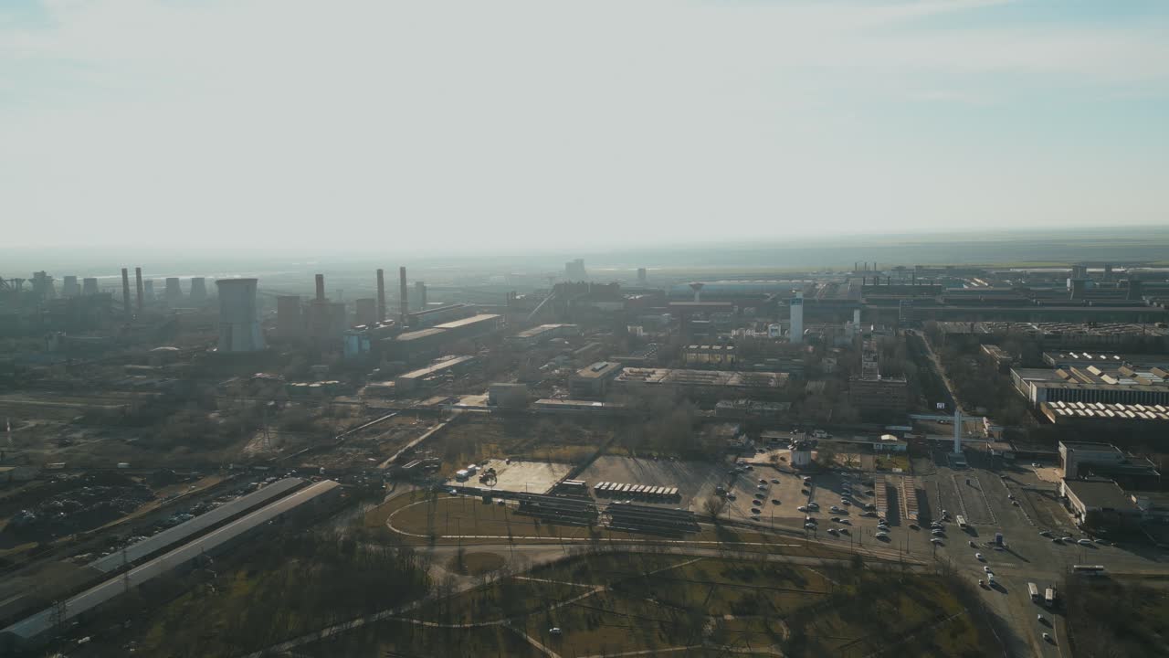 Thick Smog Over Steel Manufacturing Plant At Industrial Zone In Galati, Romania In Daytime. wide aerial shot