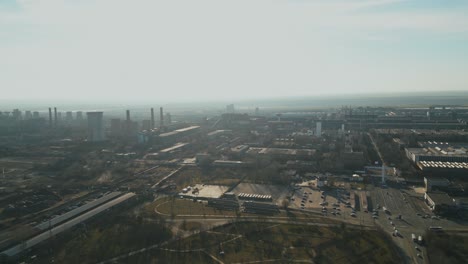 thick smog over steel manufacturing plant at industrial zone in galati, romania in daytime. wide aerial shot