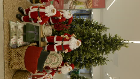 vertical video of christmas shopping mall decorations with santa and xmas tree