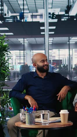 vertical video female entrepreneur deals with migraine during important meeting with investors