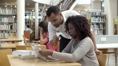 concentrated people reading information from laptop