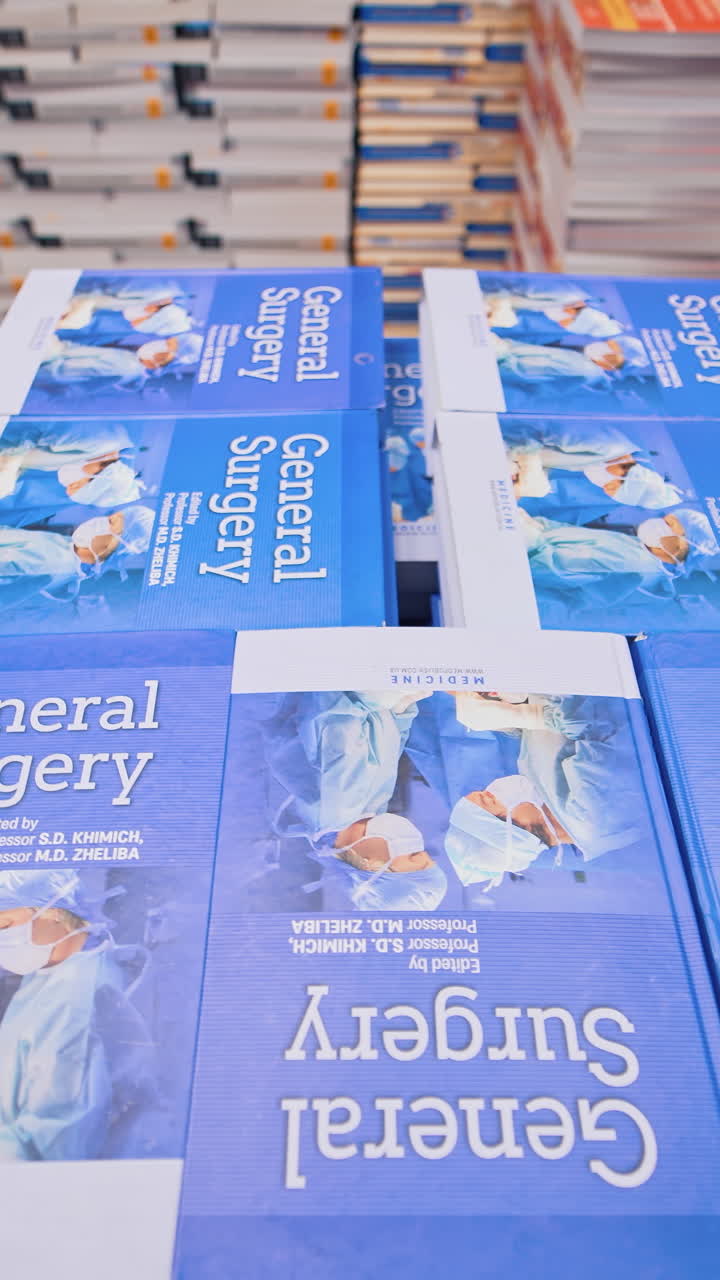 Stack of books background. View between the rows of bookshelves. Vertical video