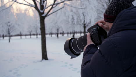 photographer capturing winter wonderland scene