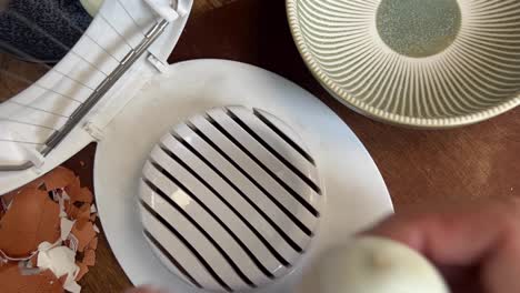 Cutting-hard-boiled-eggs-with-a-wire-slicer