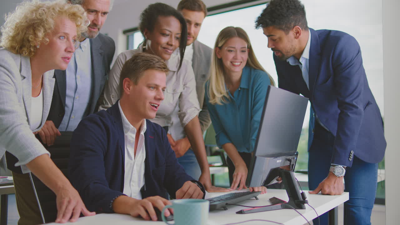 Team Celebrating Success in Office