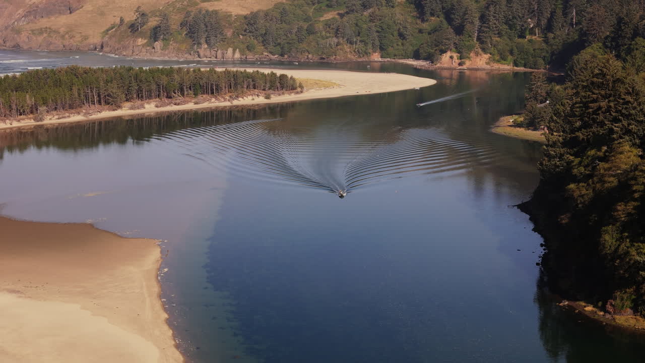 Aerial view of a river meeting the ocean