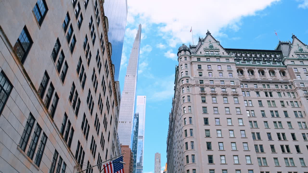 Facades of the multi-storied buildings from low-angle perspective. Stunning skyscrapers at backdrop. New York, USA