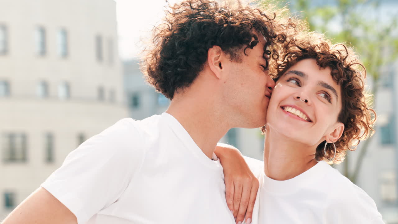 Happy Couple Kissing Outdoors