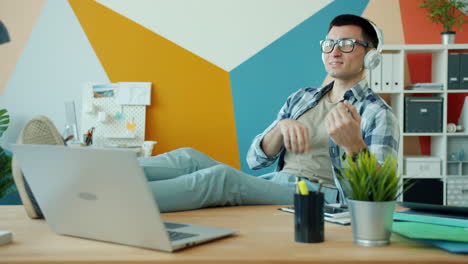 man enjoying music while working from home