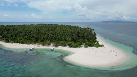 aerial parallax around banca outrigger boat on patongong island balabac coastline