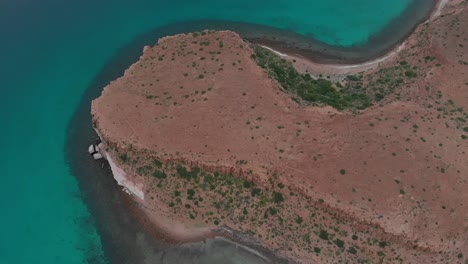 jib up above espiritu santo island with a boat navigating in baja california sur