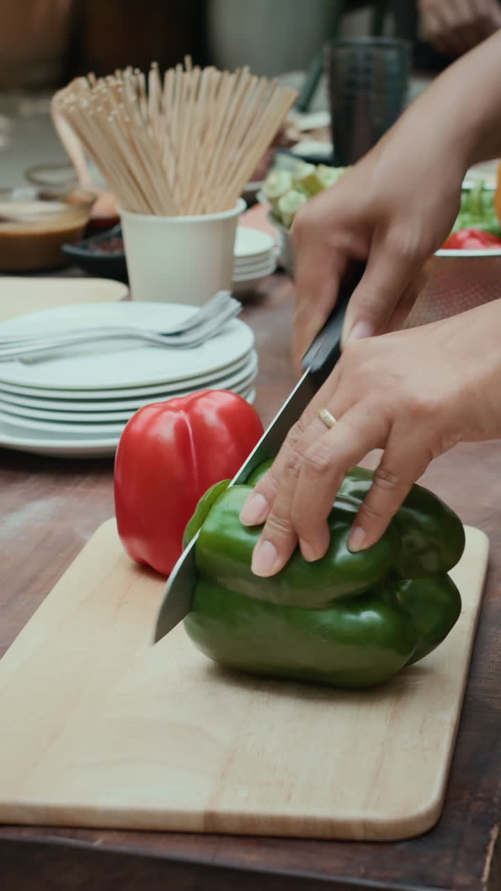 Hands of People Cooking for Barbecue Vertical