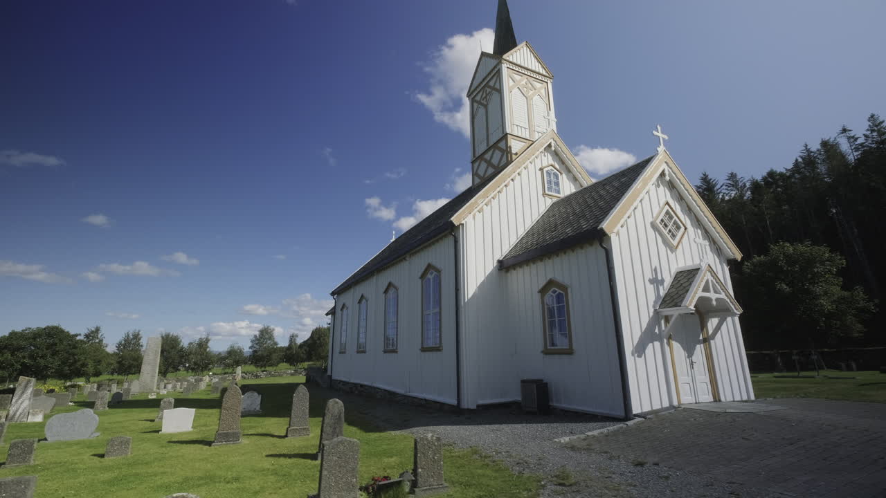 A nice and tiny white Norwegian church, circling shot