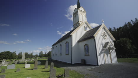 a nice and tiny white norwegian church, circling shot
