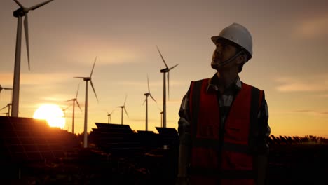 engineer at a renewable energy facility at sunset