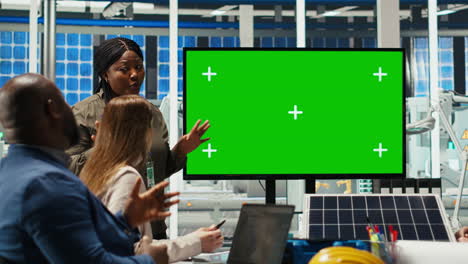 solar panels plant manager uses isolated screen monitor during presentation