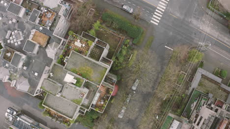 aerial flying over the rooftop of a high-rise building