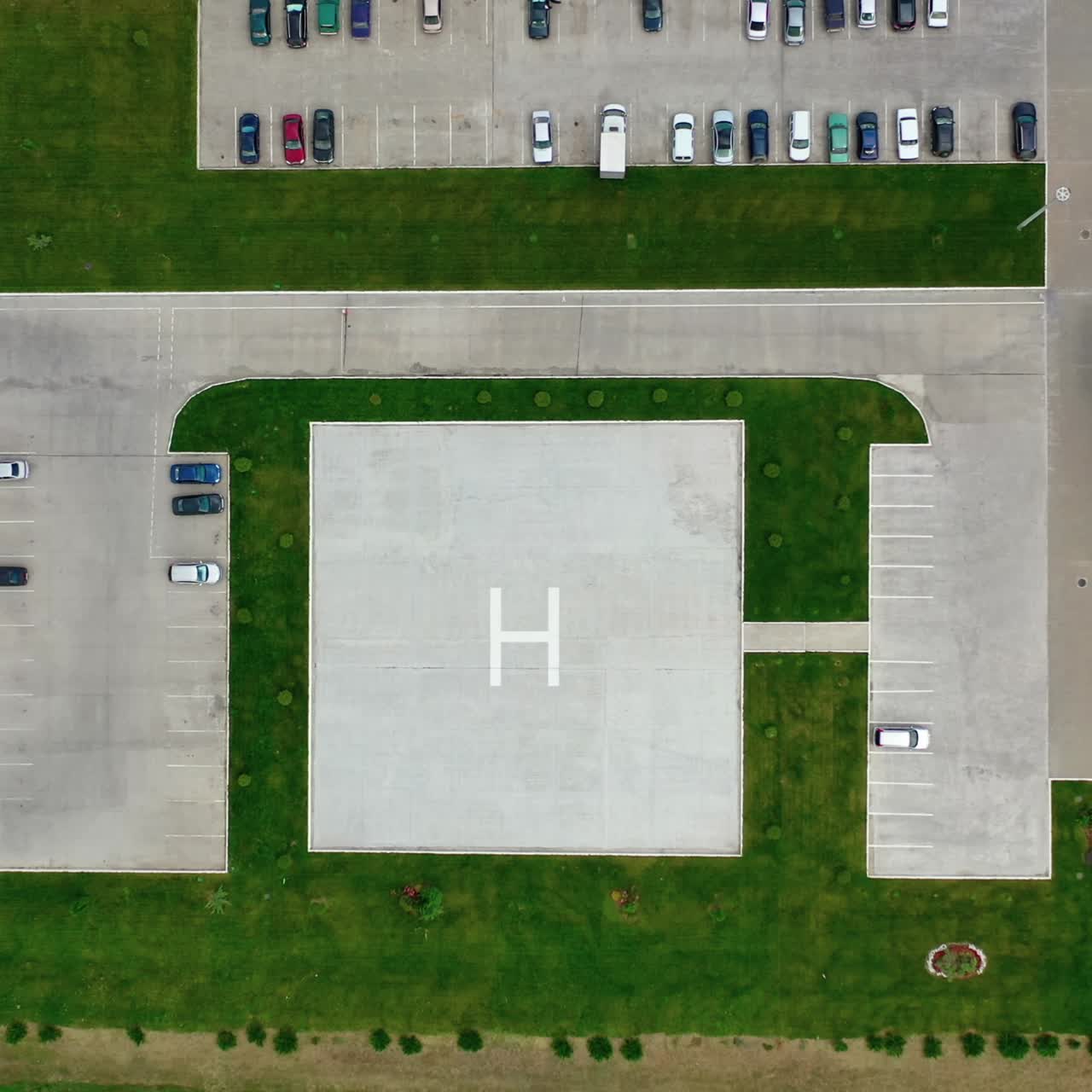Aerial view of a large modern industrial factory. Helicopter landing place site. Logistics from above