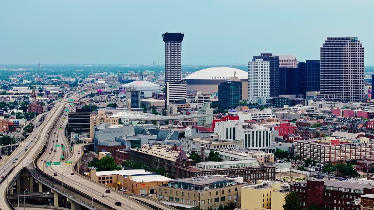 Skyscraper Of Plaza Tower With Caesars Superdome In The Background In New Orleans, Louisiana, United States. Aerial Wide Shot